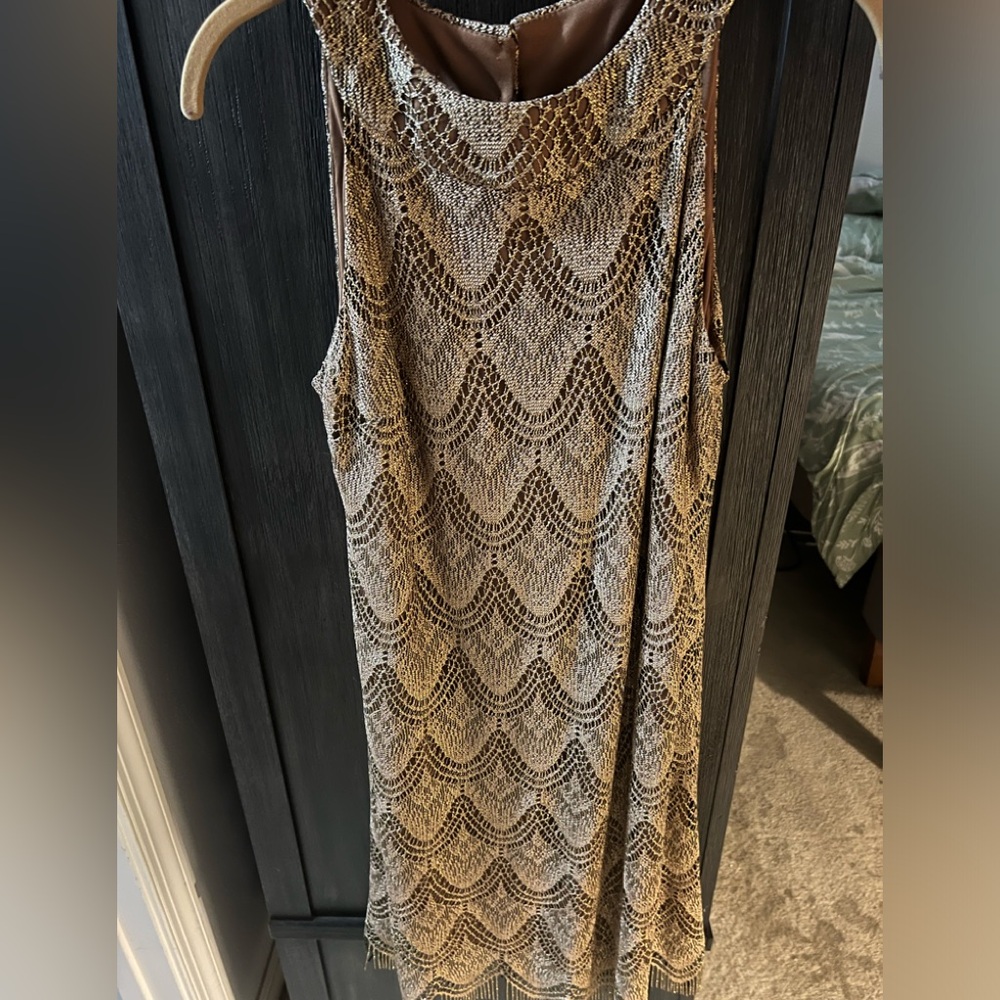 Cute gold dress that can be worn for a night out of a semi formal occasion!!